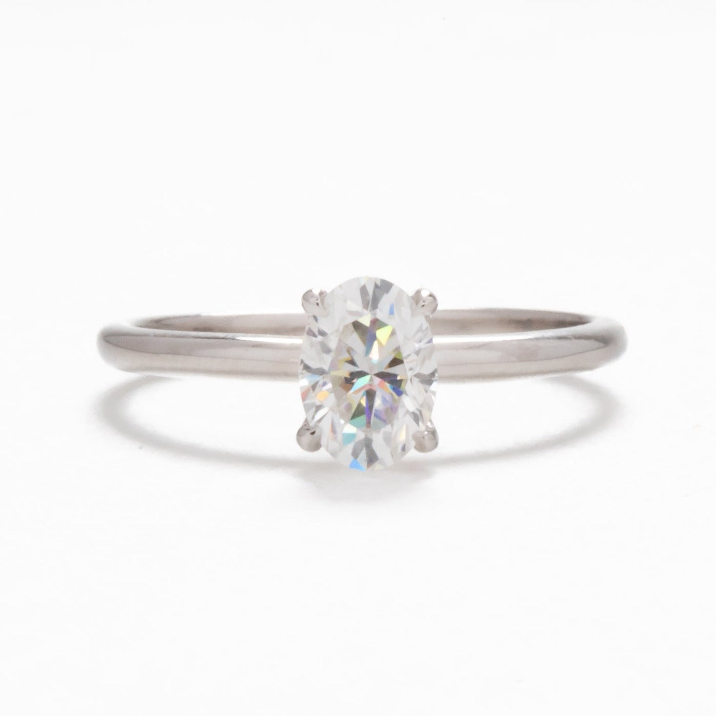 petite oval solitaire engagement ring