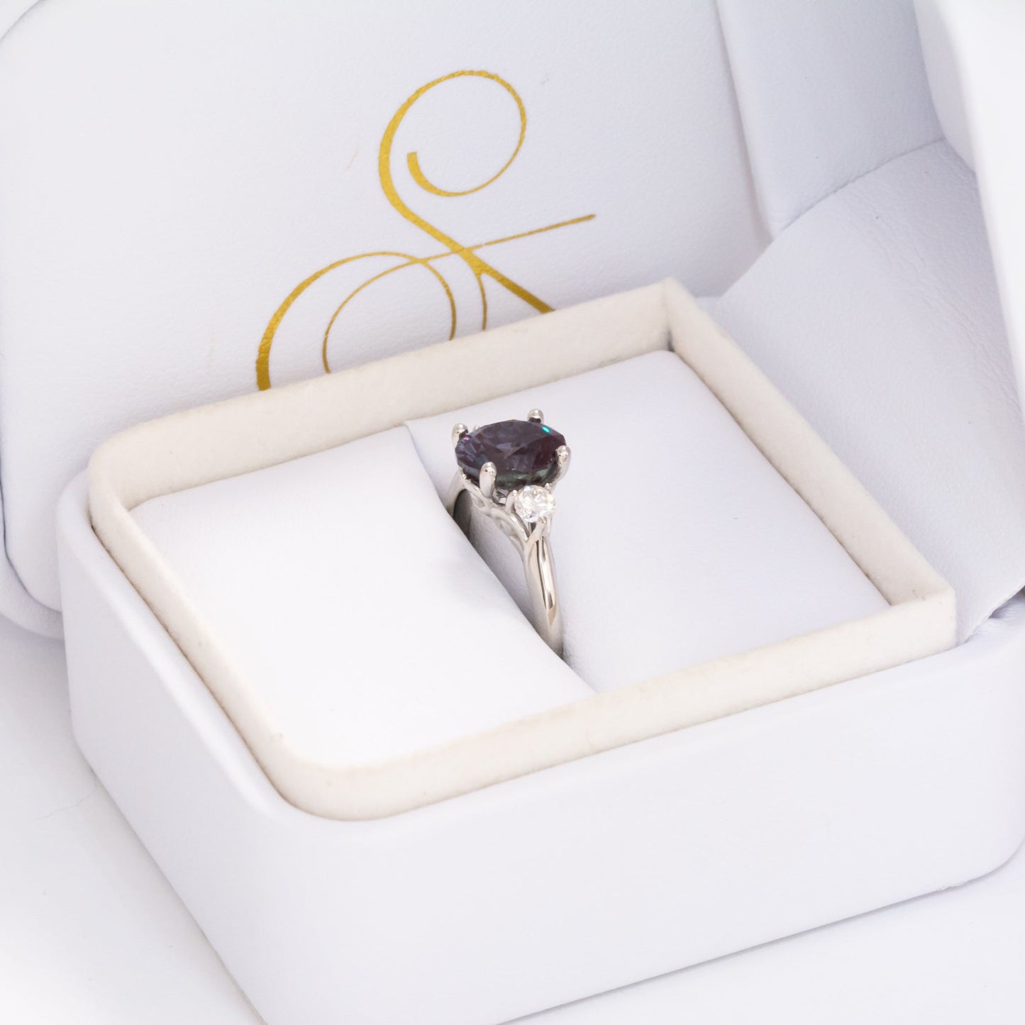 robin three stone engagement ring with oval lab alexandrite
