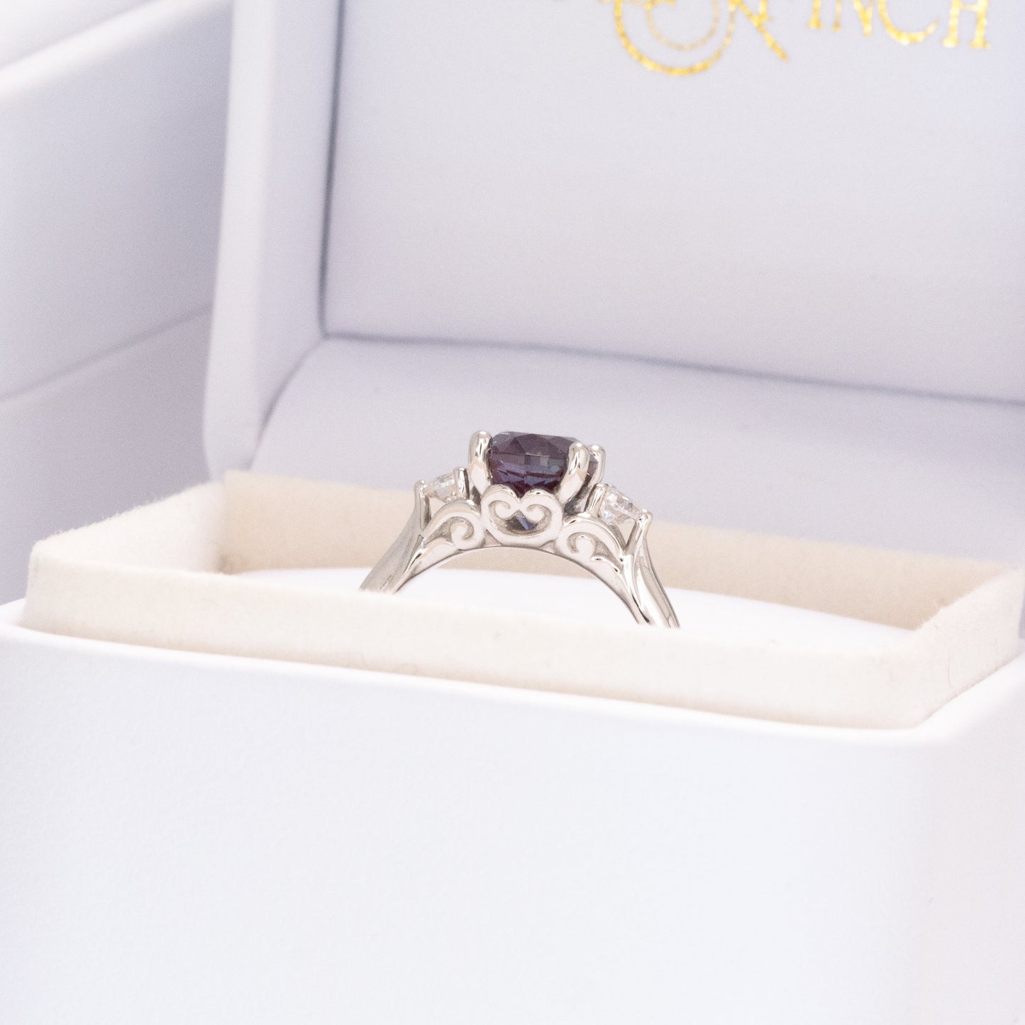 robin three stone engagement ring with oval lab alexandrite