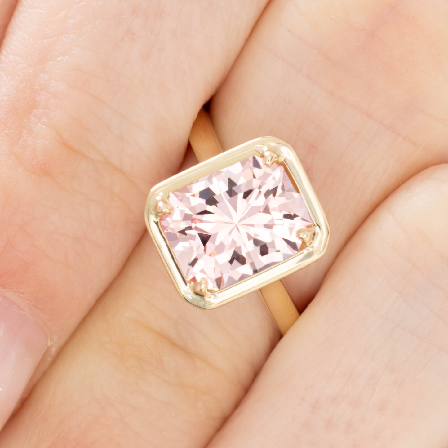 rory solitaire engagement ring with radiant pink lab sapphire