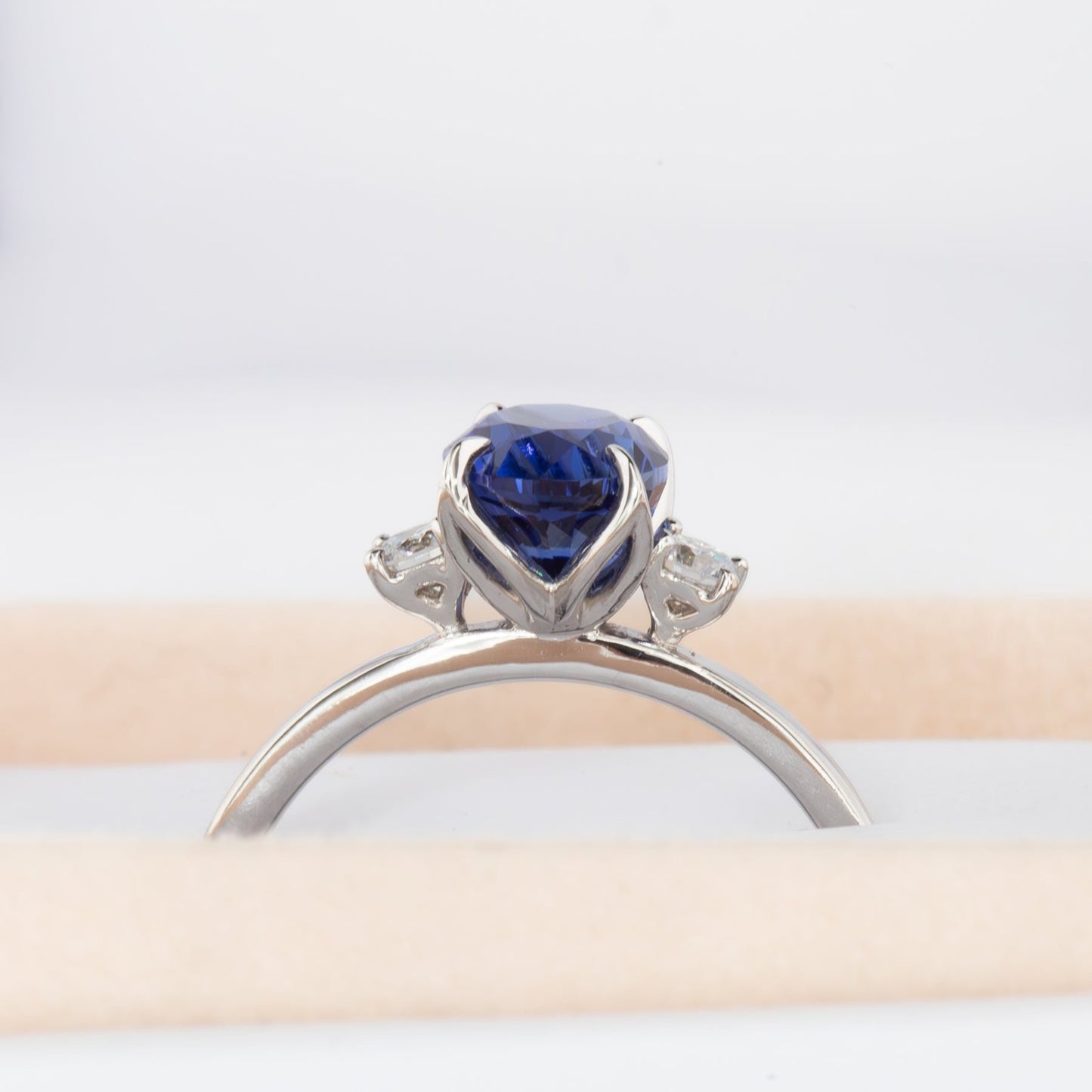 royal blue lab sapphire three stone engagement ring in white gold