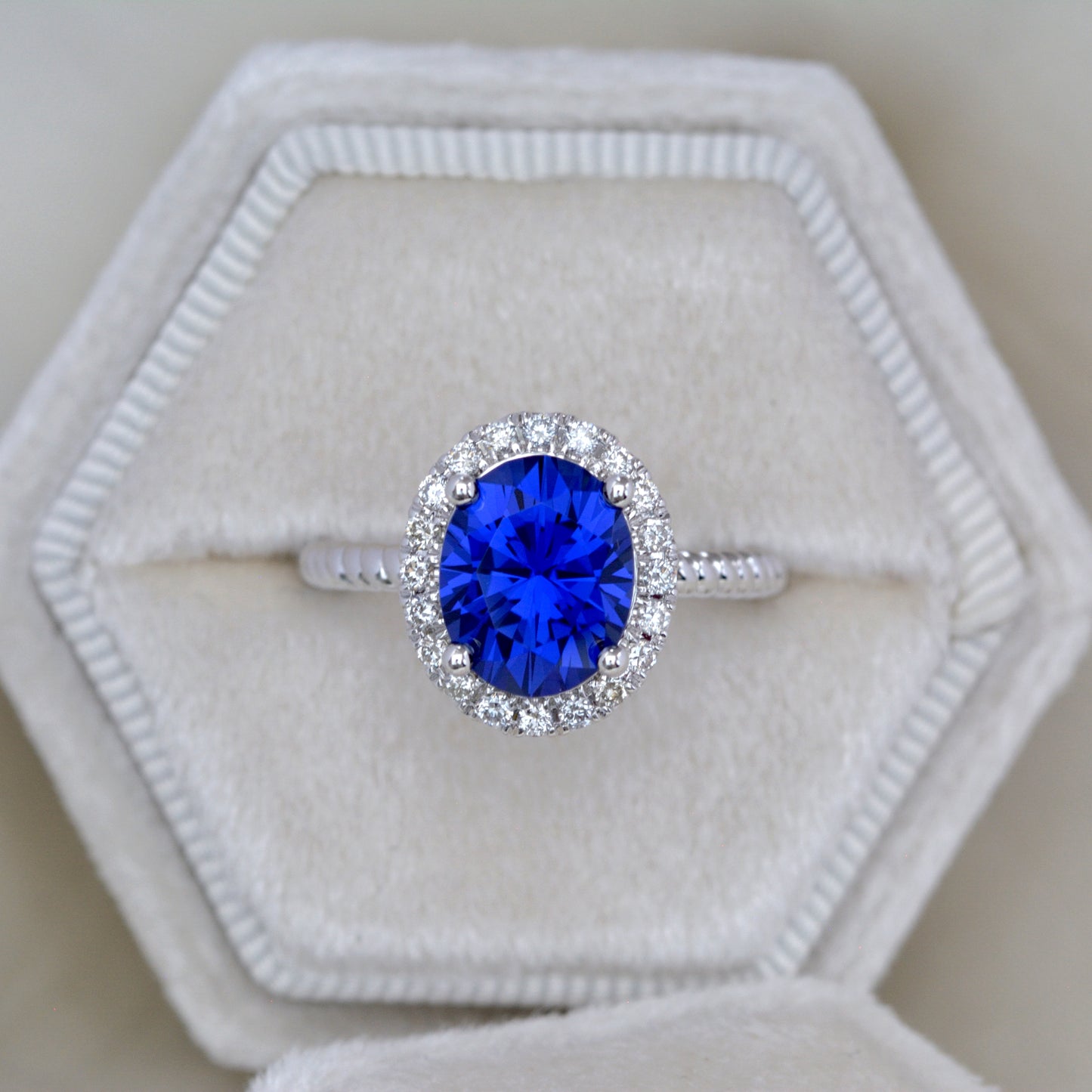 royal blue oval lab sapphire halo engagement ring