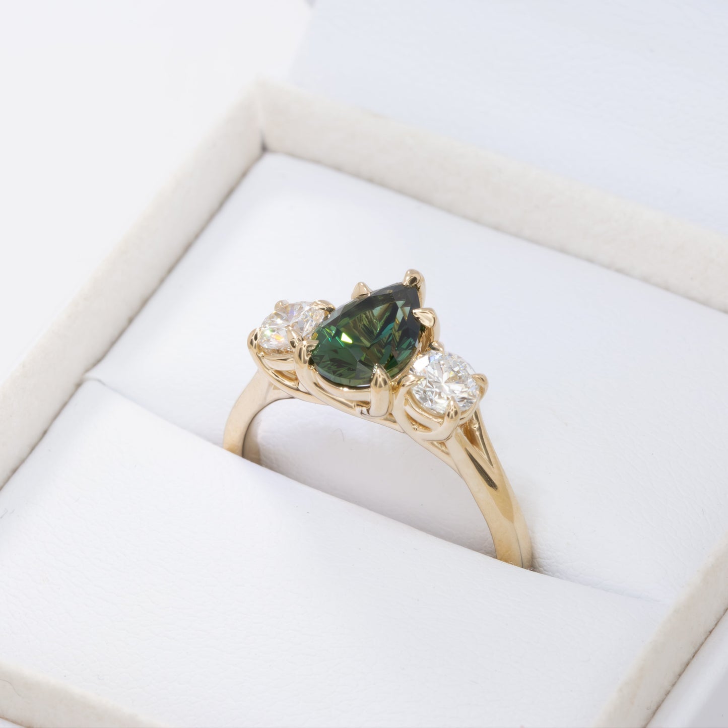 rylee three stone engagement ring with pear green lab sapphire