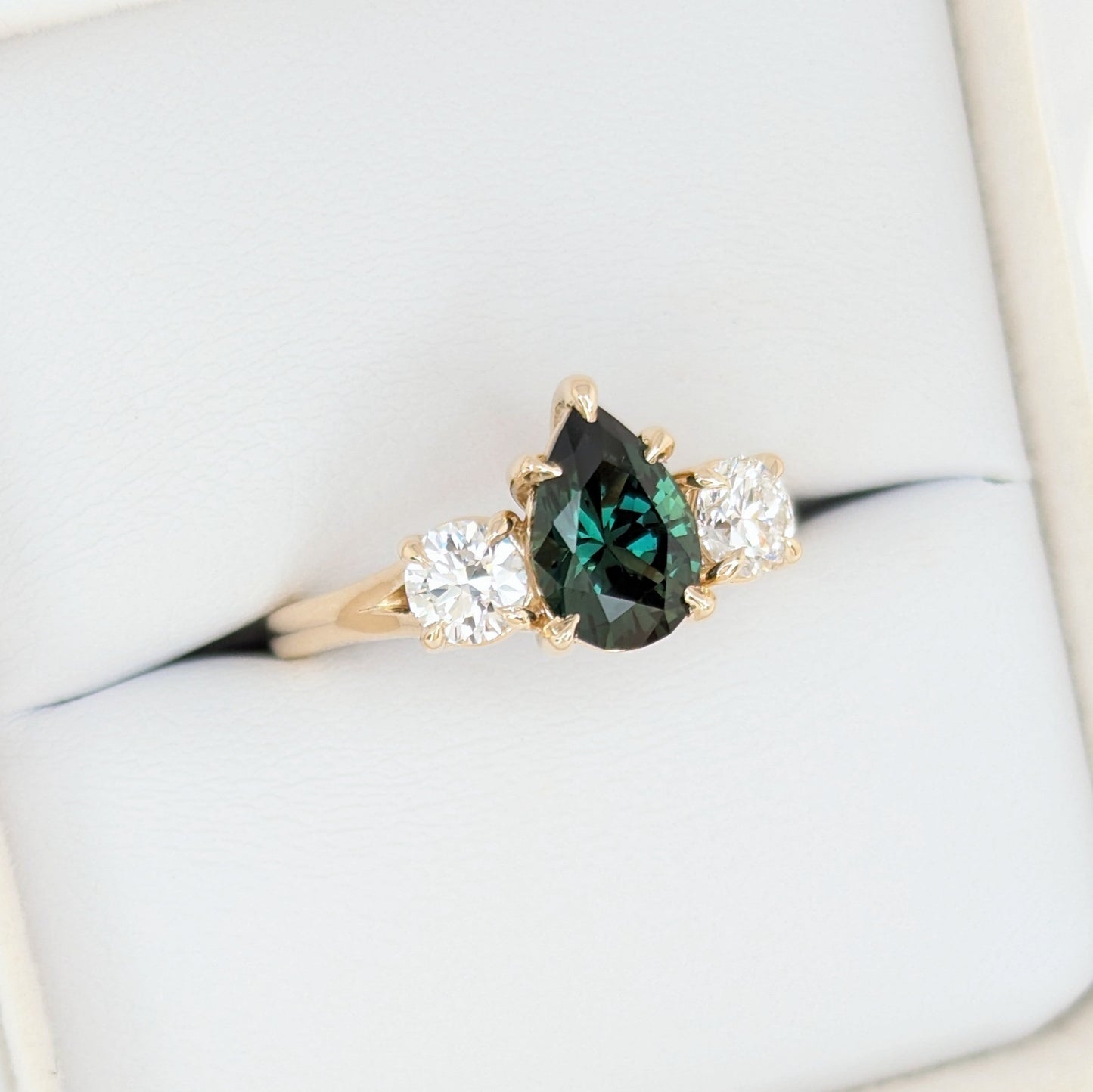 rylee three stone engagement ring with pear green lab sapphire