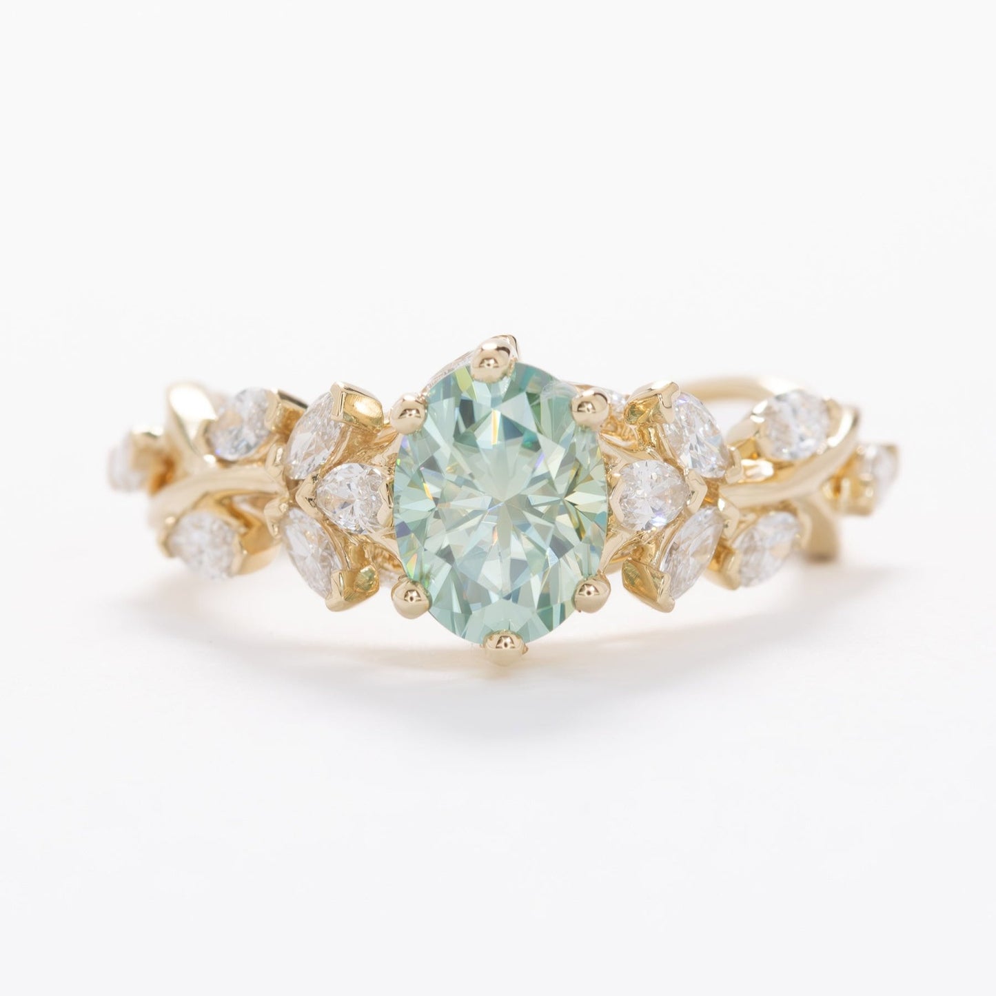 senna nature inspired engagement ring with oval blue-green moissanite