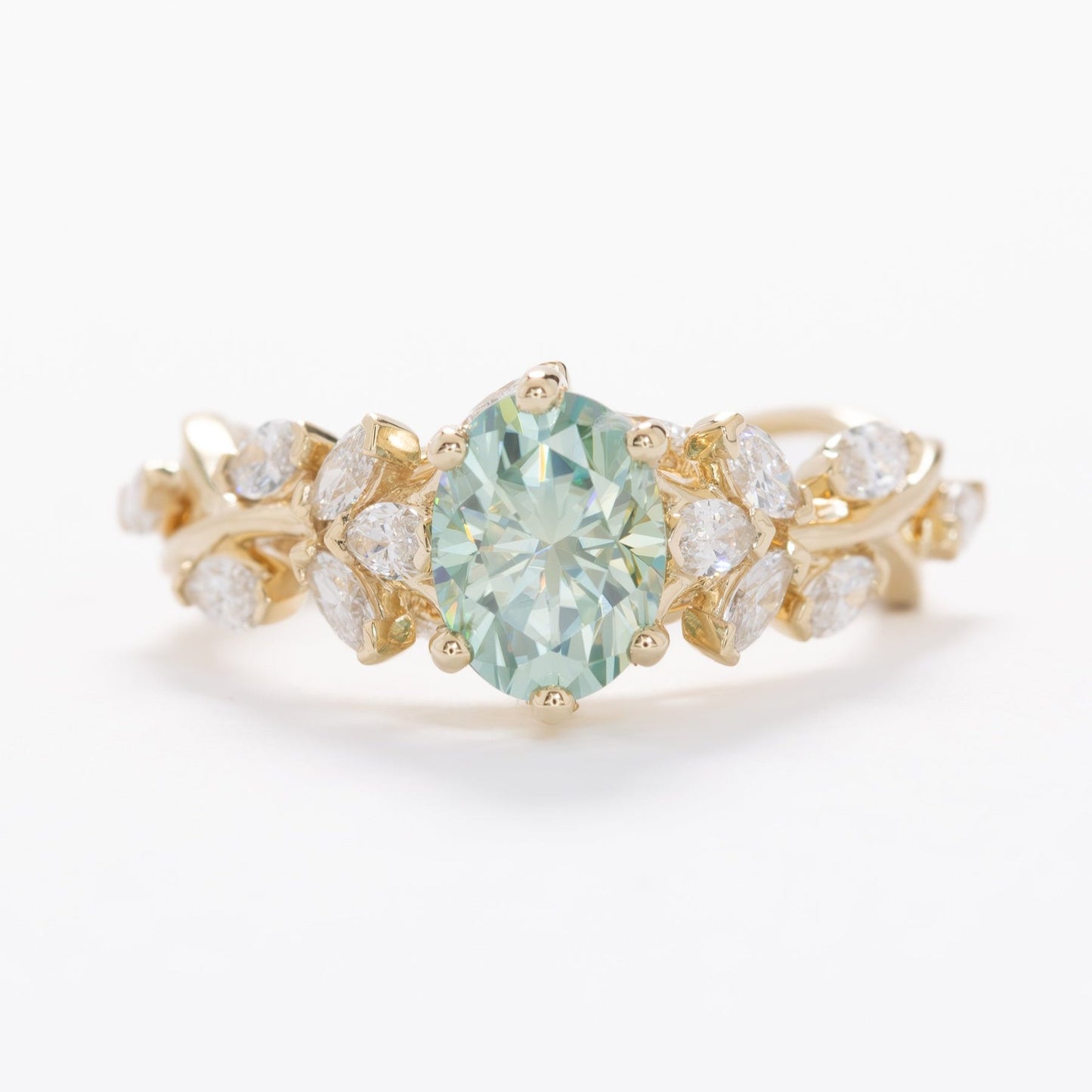 senna nature inspired engagement ring with oval blue-green moissanite