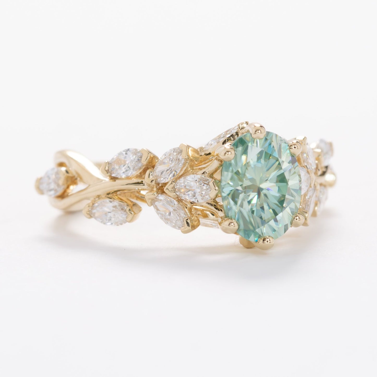 senna nature inspired engagement ring with oval blue-green moissanite