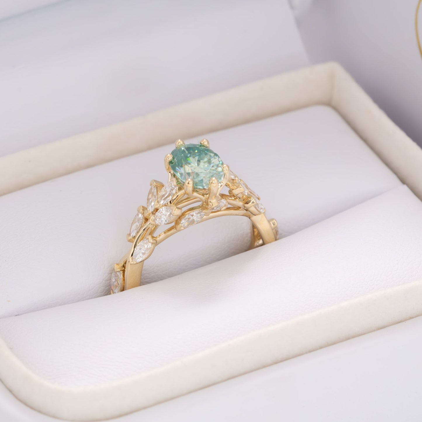 senna nature inspired engagement ring with oval blue-green moissanite