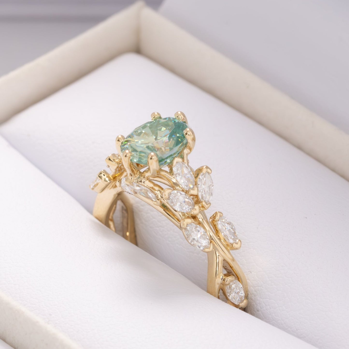 senna nature inspired engagement ring with oval blue-green moissanite