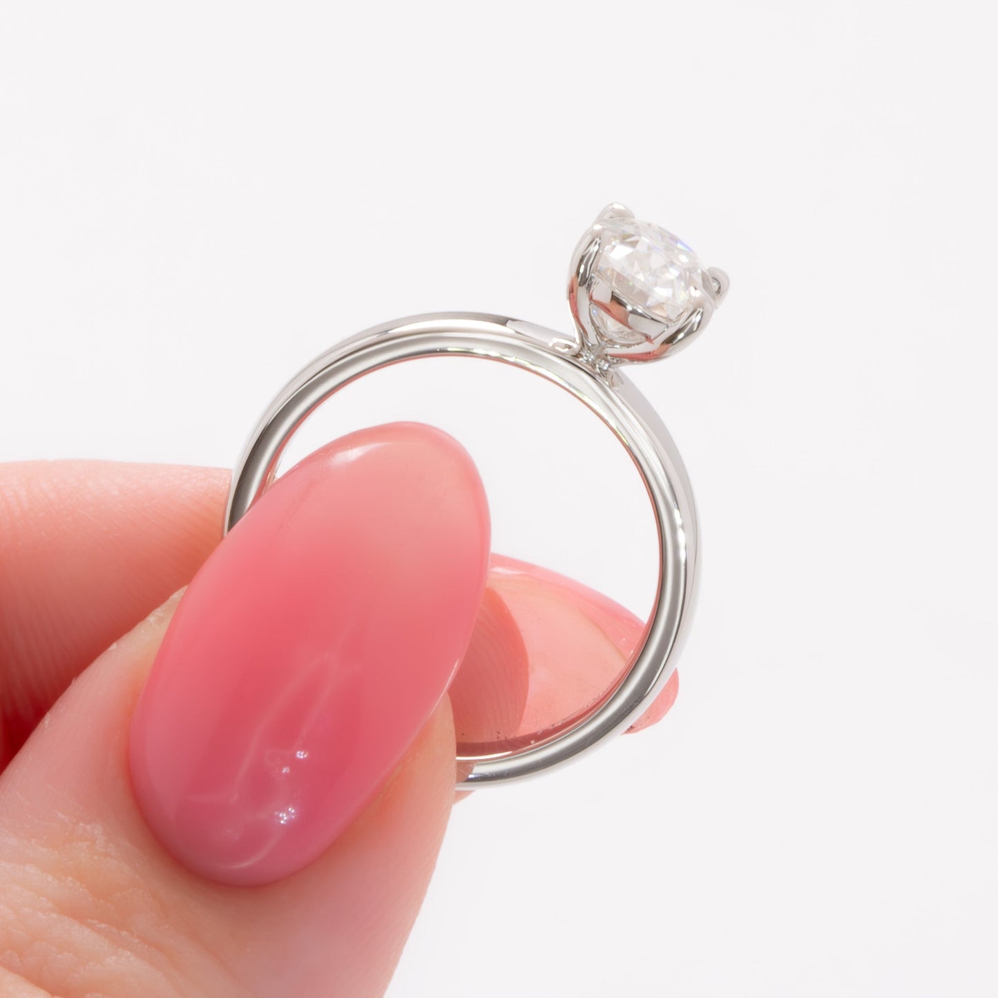 serene solitaire ring with wide band and oval white moissanite