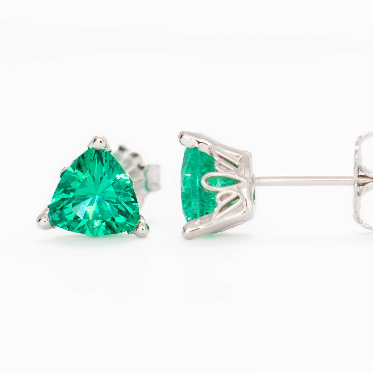 shayna stud earrings in white gold and trillion lab emeralds