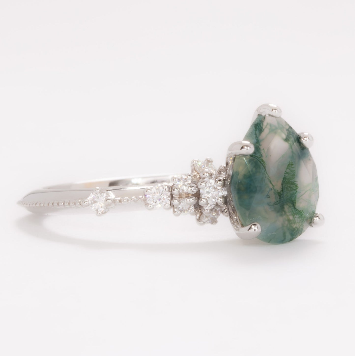 sloane engagement ring with moss agate pear