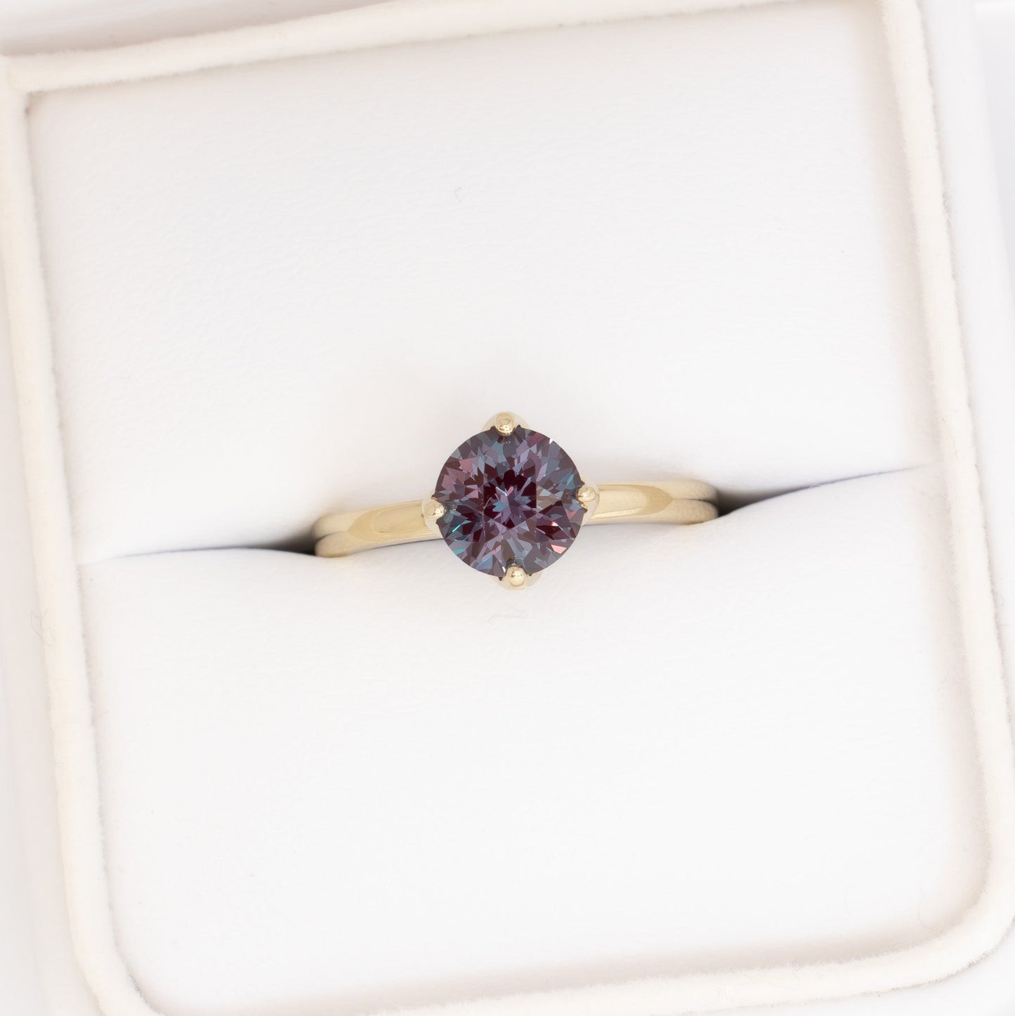 stasa solitaire engagement ring with round lab alexandrite in yellow gold