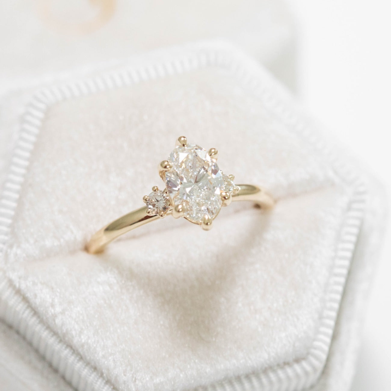 yellow gold engagement ring and band with oval lab diamond
