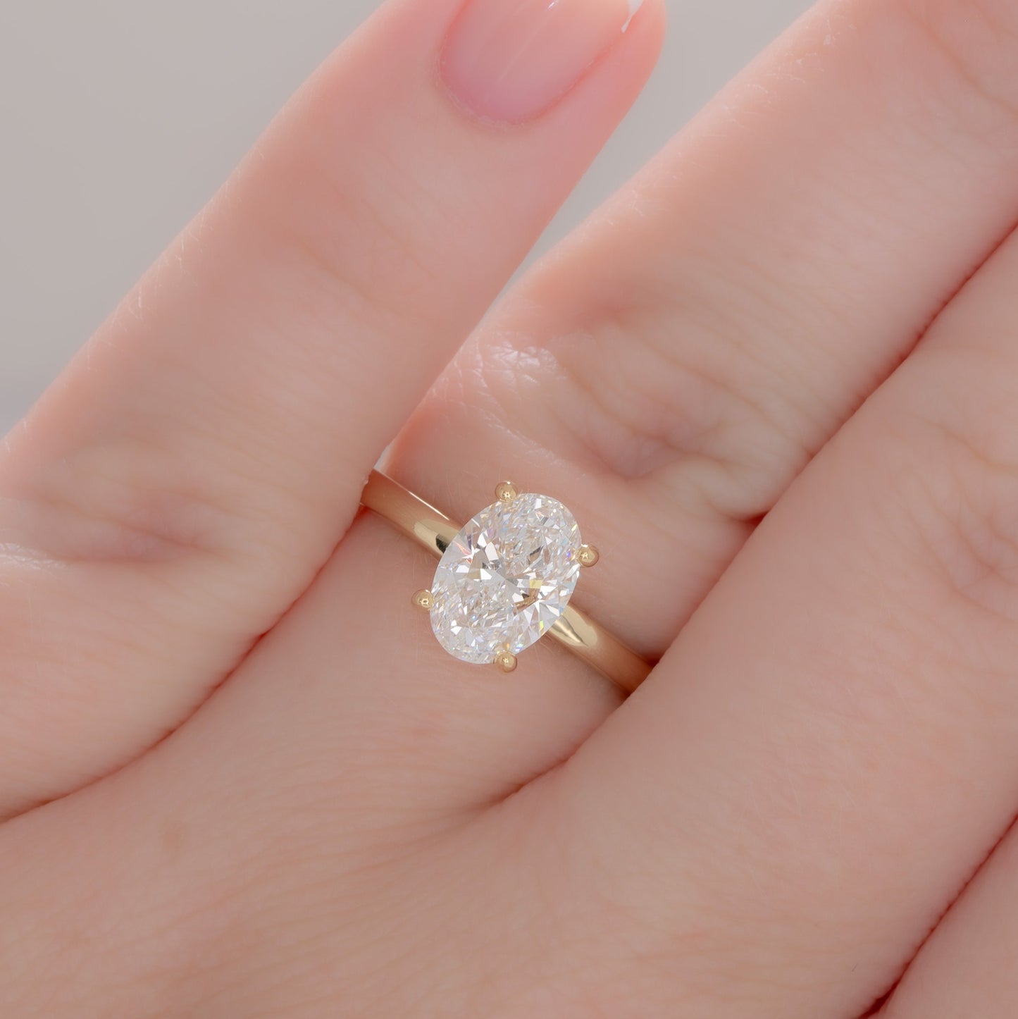 yellow gold serene solitaire with oval lab diamond