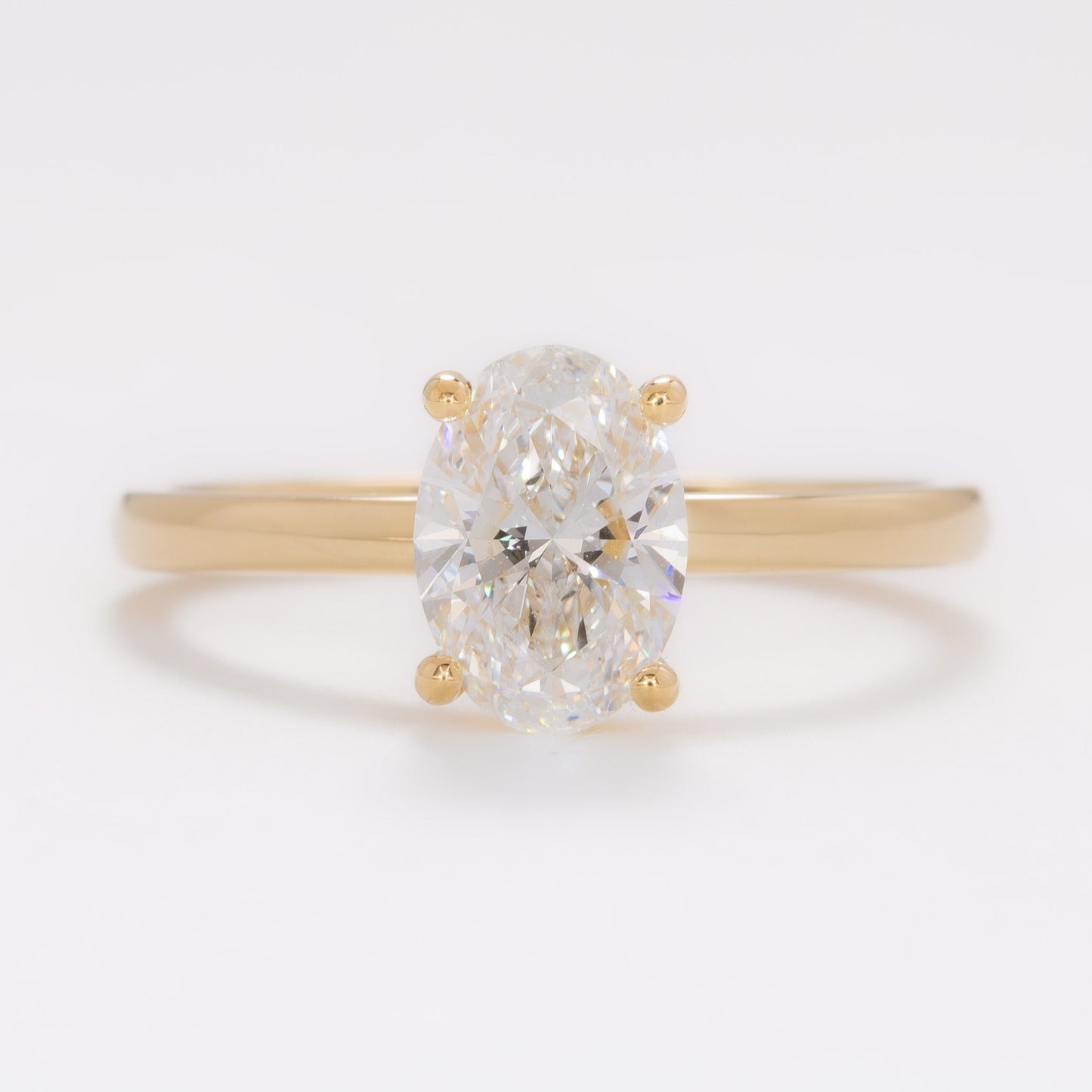 yellow gold serene solitaire with oval lab diamond