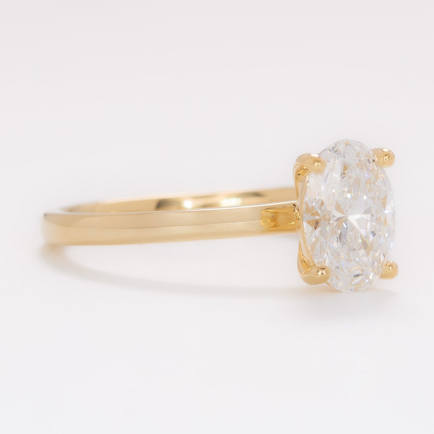 yellow gold serene solitaire with oval lab diamond