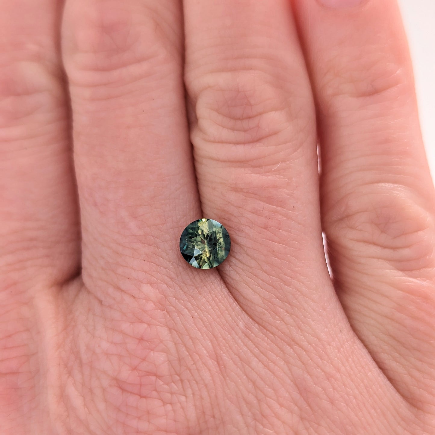 AU0122 1.09ct bi-color blue and yellow round cut australian sapphire