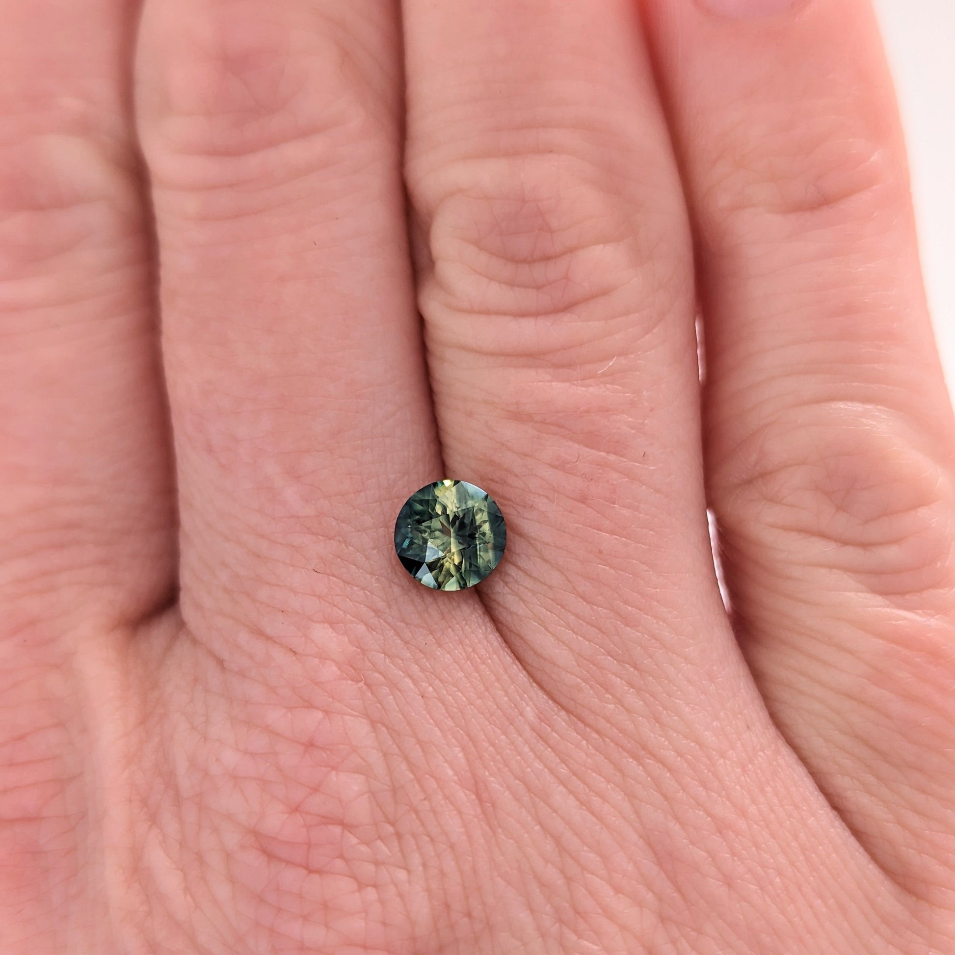 AU0122 1.09ct bi-color blue and yellow round cut australian sapphire