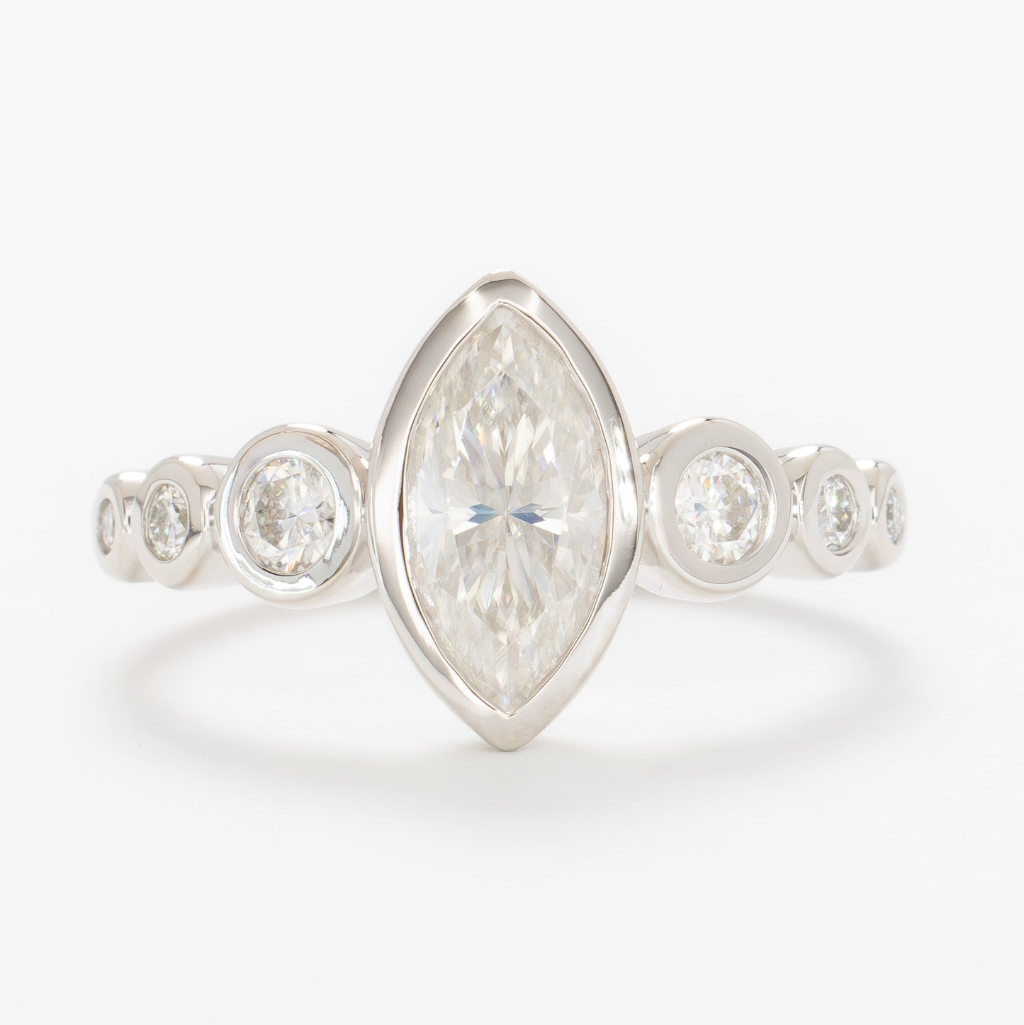 Aisha bezel set engagement ring with white moissanite marquise