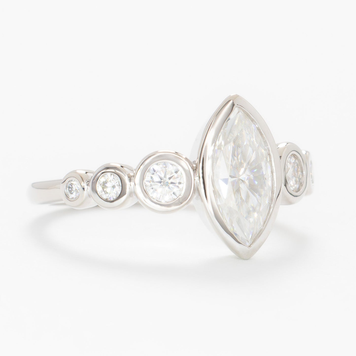 Aisha bezel set engagement ring with white moissanite marquise