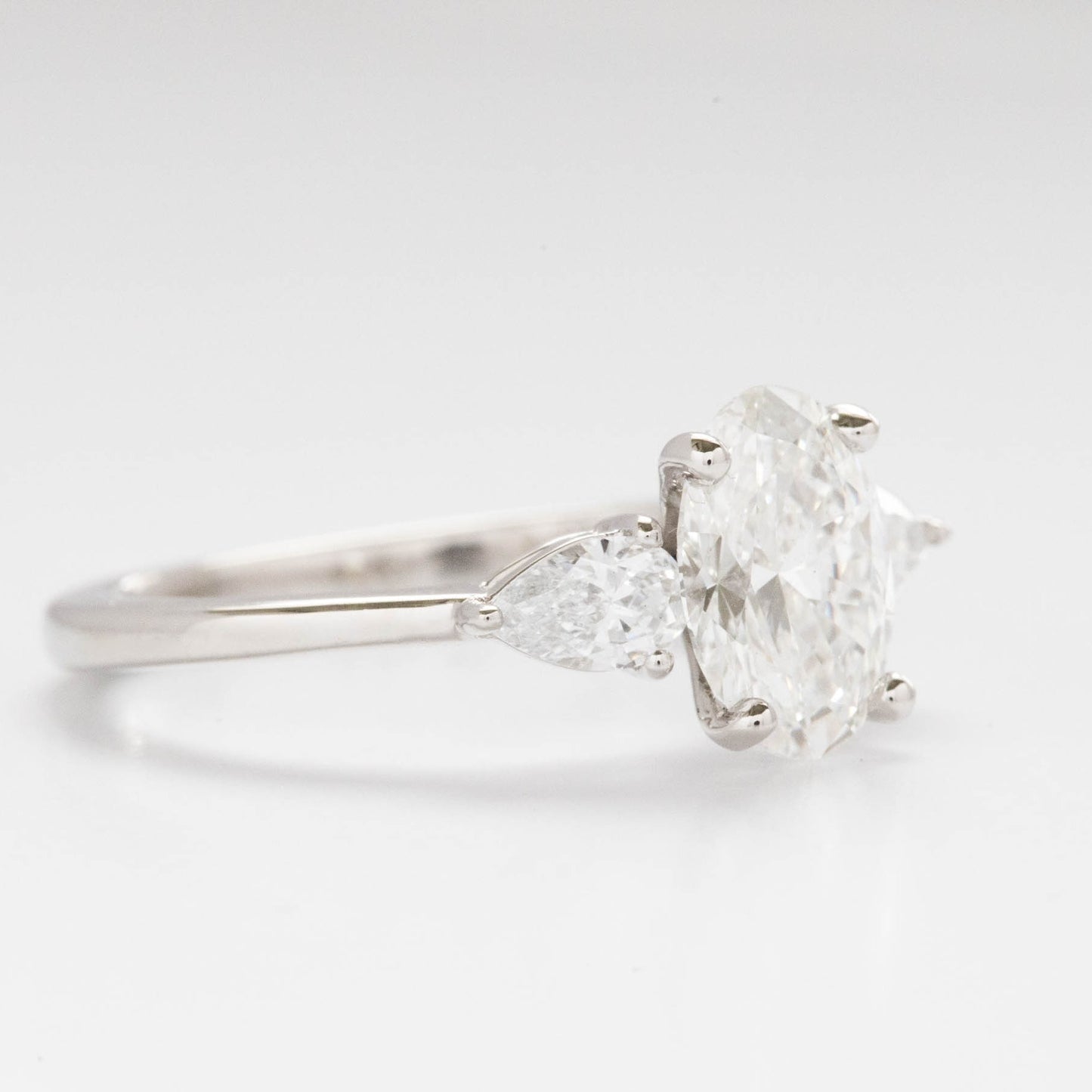 Beckett engagement ring with oval and pear lab diamonds