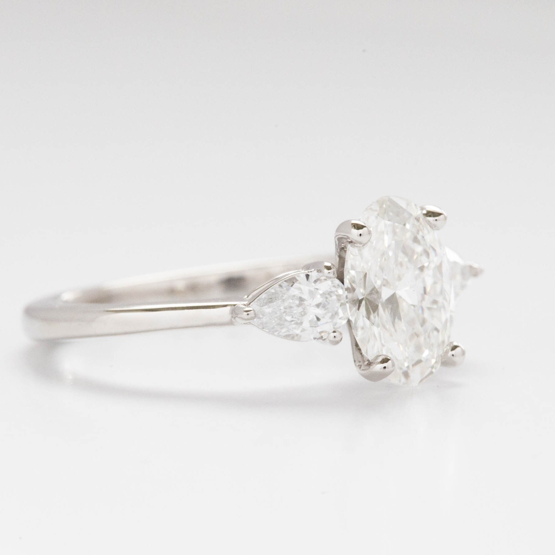 Beckett engagement ring with oval and pear lab diamonds