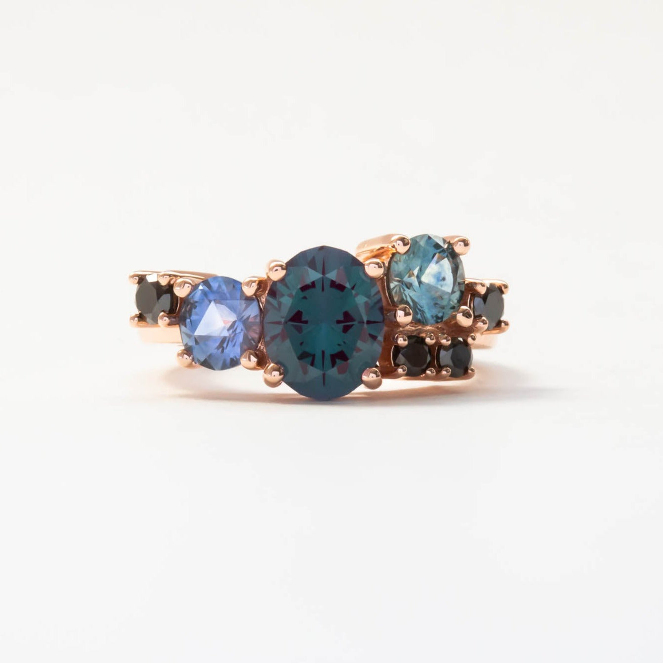Custom cluster engagement ring with alexandrite and montana sapphires