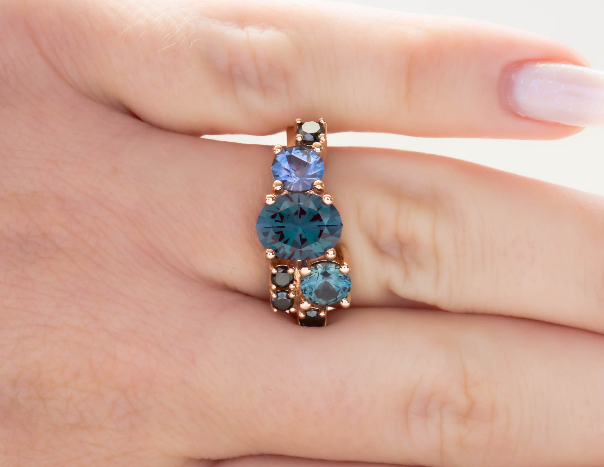 Custom cluster engagement ring with alexandrite and montana sapphires