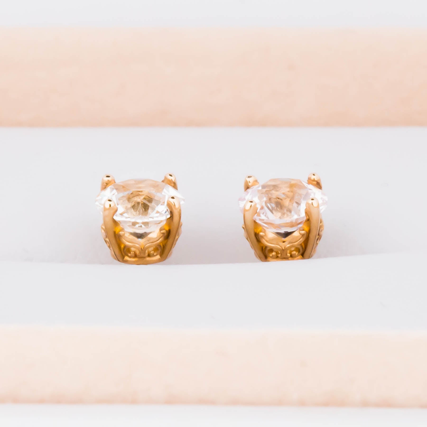 white lab sapphire earrings in yellow gold