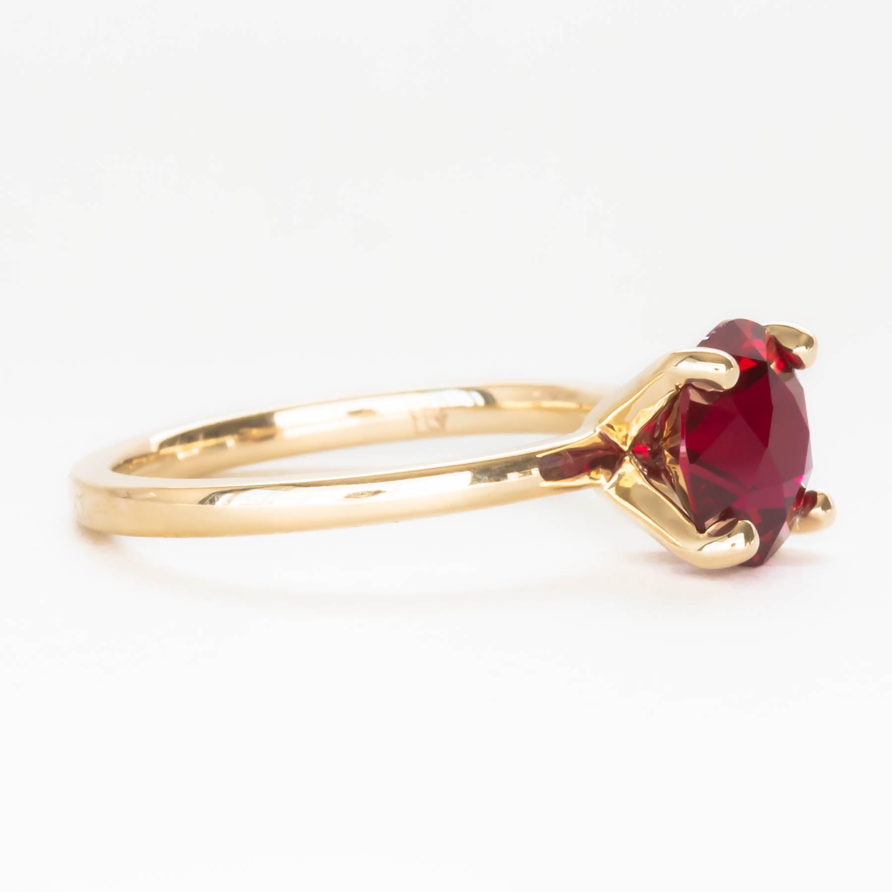 Evie solitaire engagement ring with lab ruby