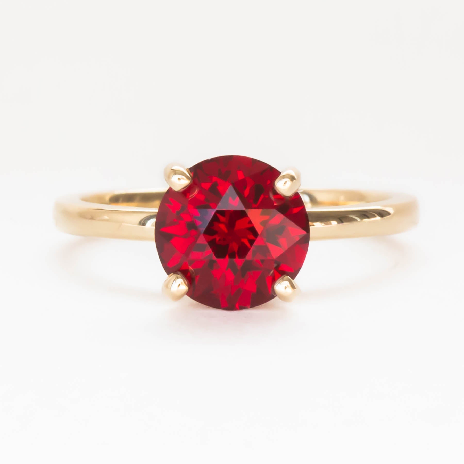 Evie solitaire engagement ring with lab ruby