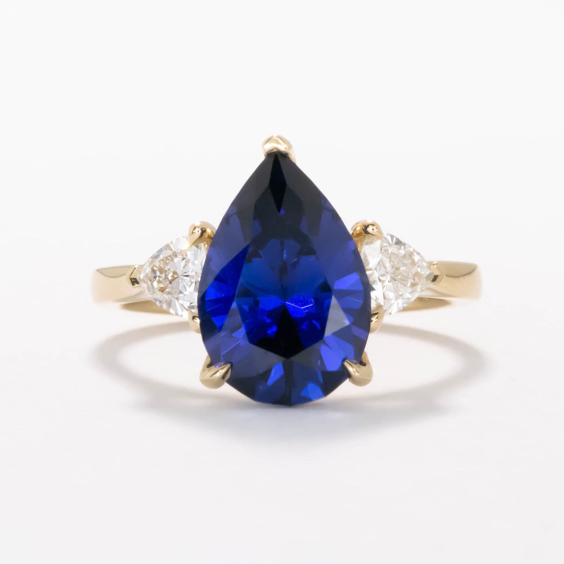 Fiona three stone engagement ring with blue lab sapphire pear