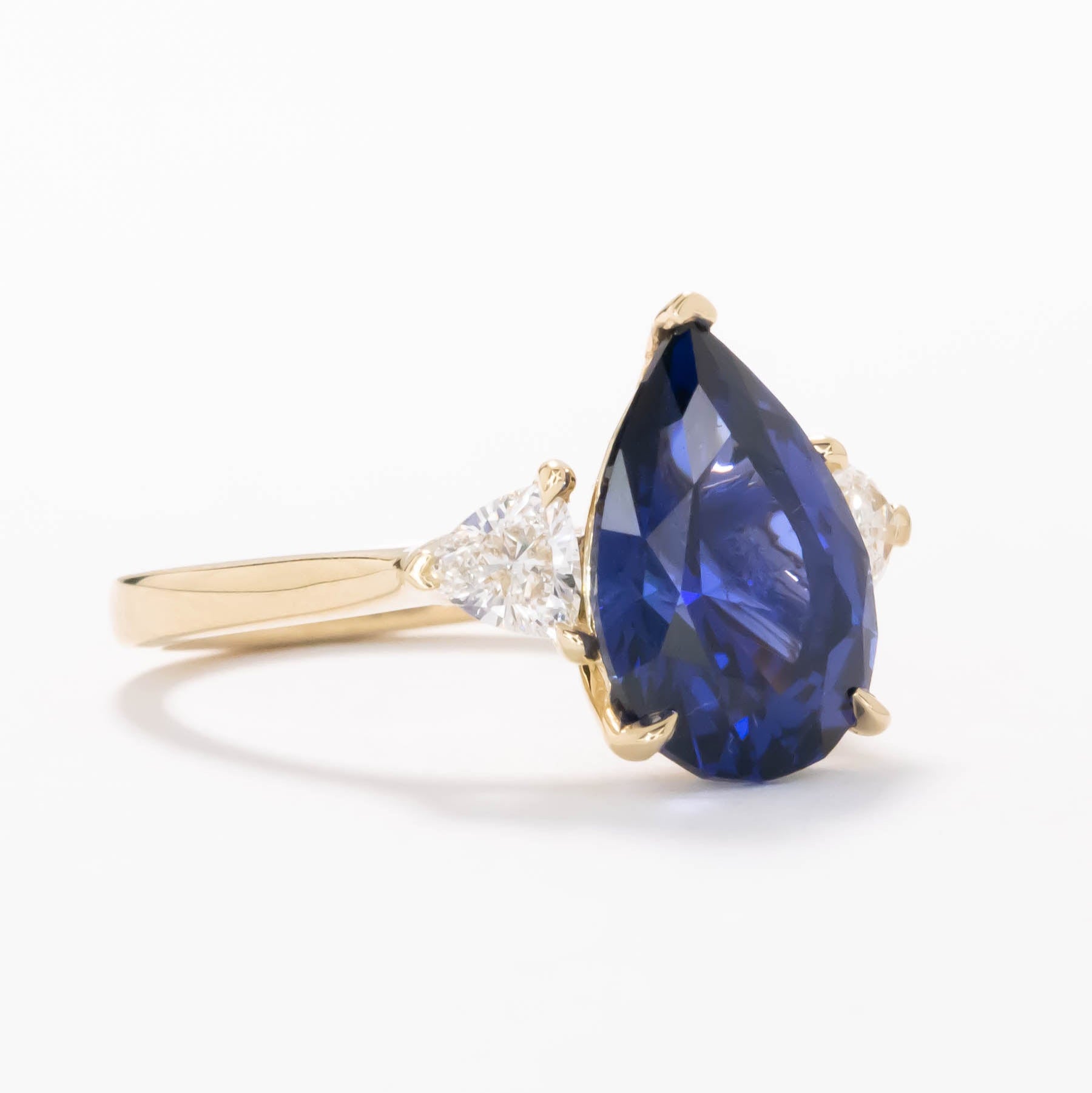 Fiona three stone engagement ring with blue lab sapphire pear