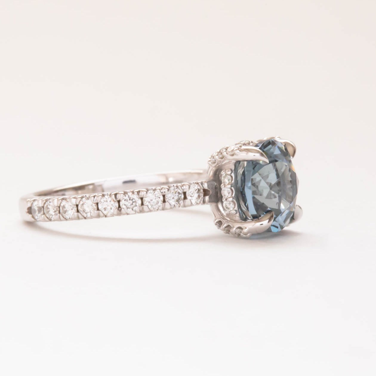 Janja light blue hidden halo engagement ring