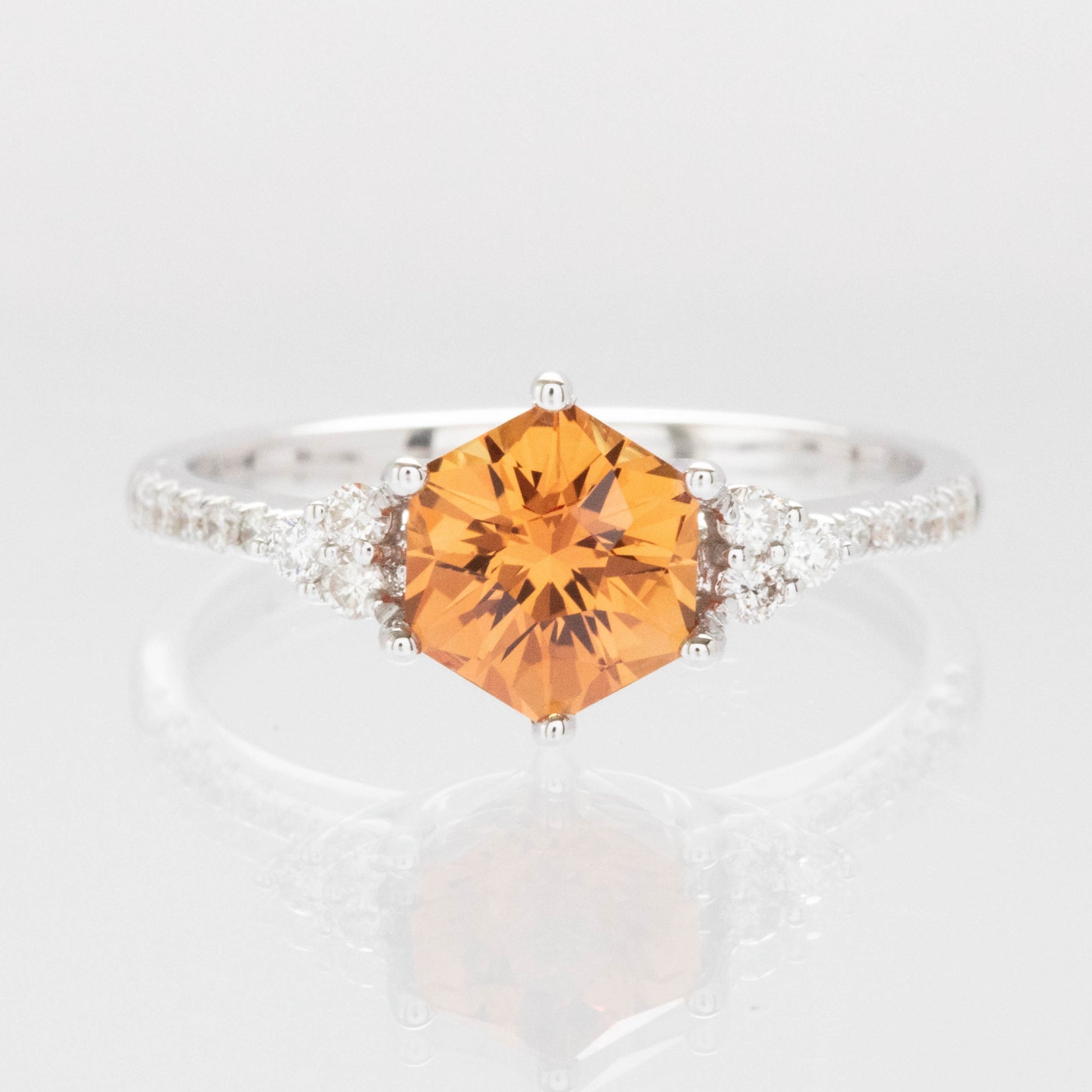 Juliette engagement ring with hex cut orange lab sapphire