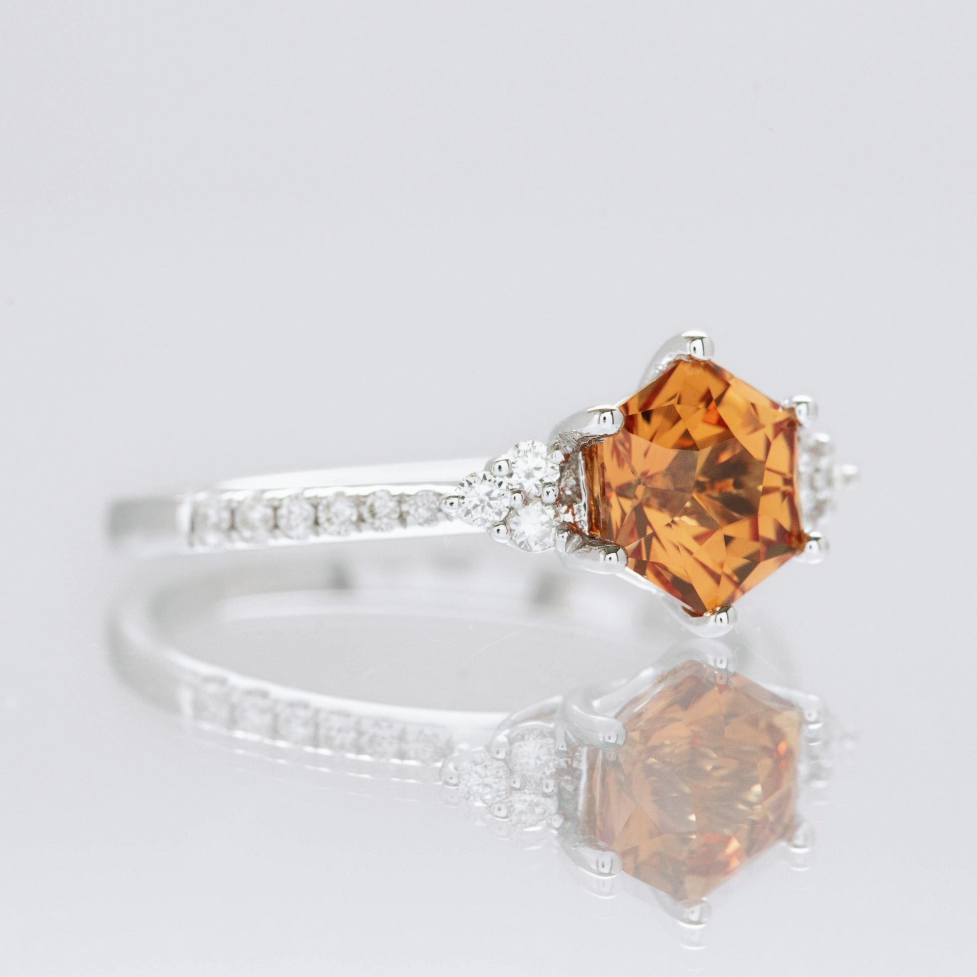 Juliette engagement ring with hex cut orange lab sapphire