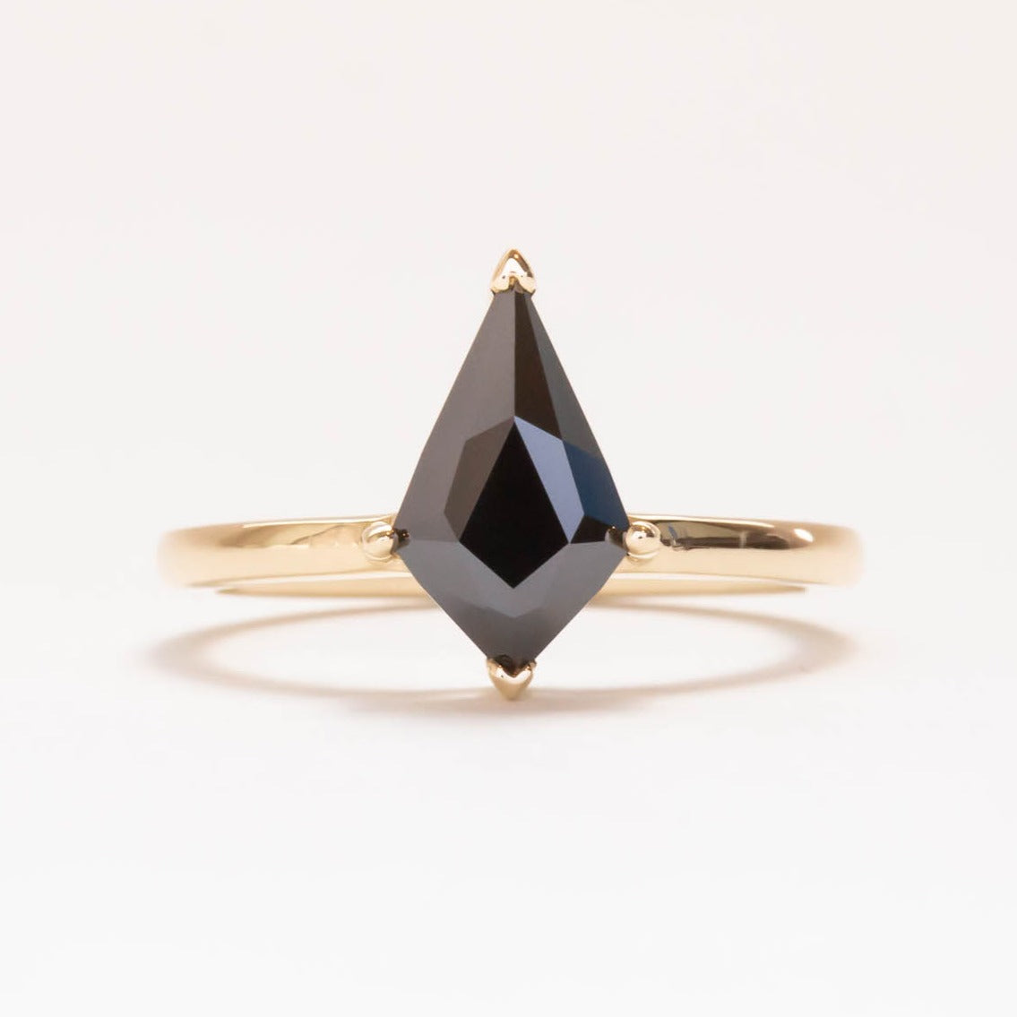 Kite solitaire engagement ring with black moissanite