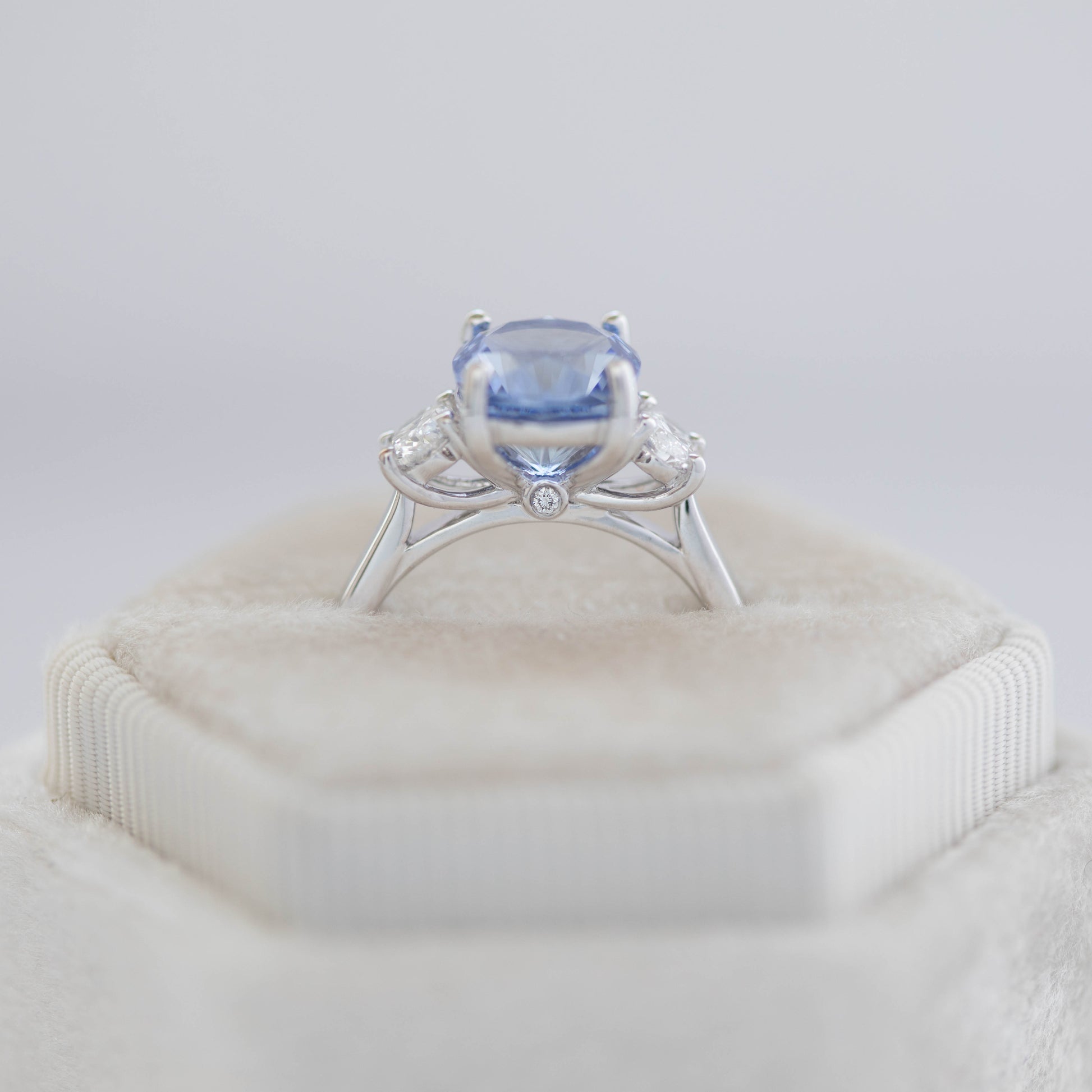 Milly three stone engagement ring with oval blue lab sapphire