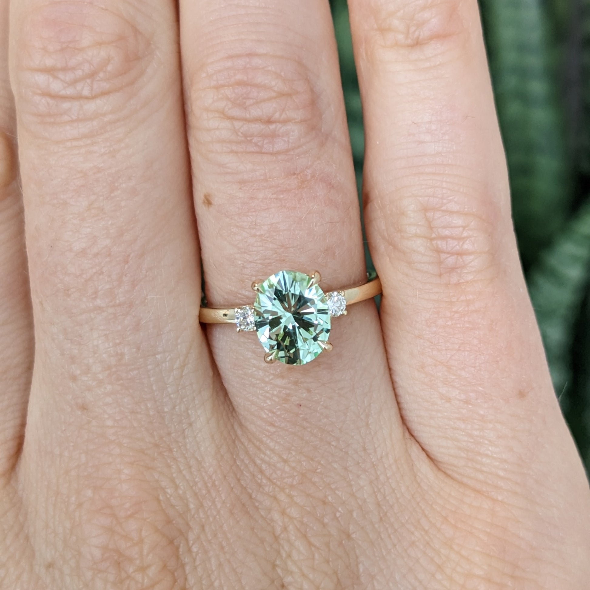 Naomi engagement ring with oval green lab sapphire