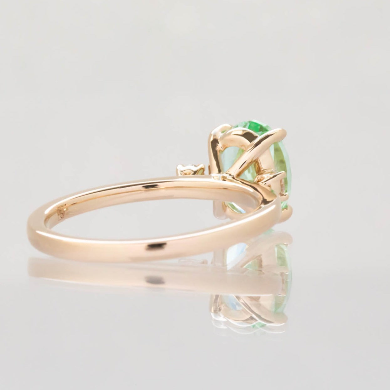 Naomi engagement ring with oval green lab sapphire