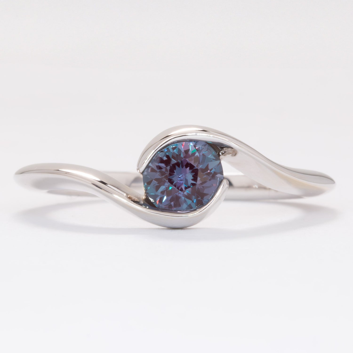 Olive solitaire bypass engagement ring