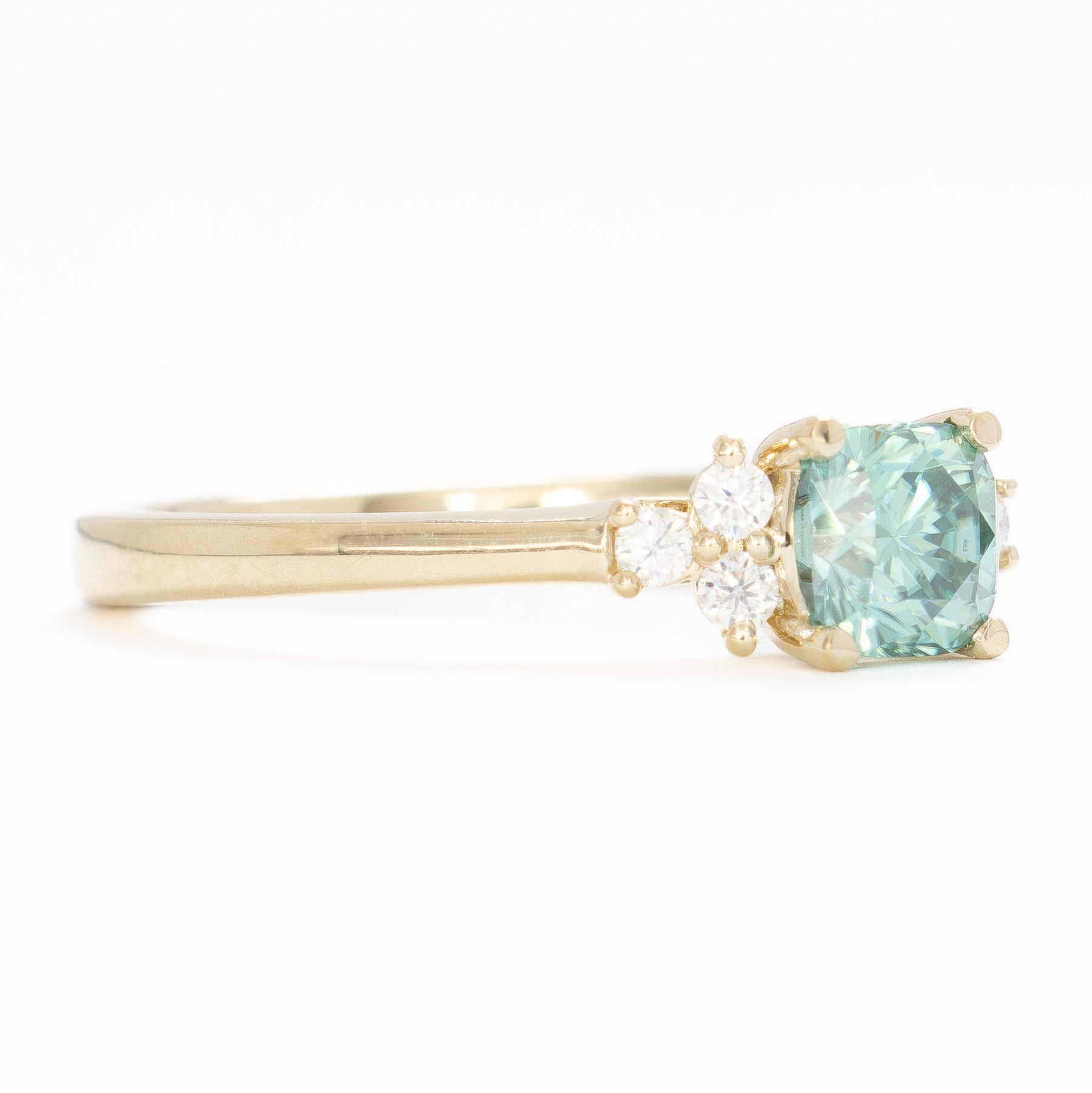 cynthia engagement ring with green moissanite cushion in yellow gold