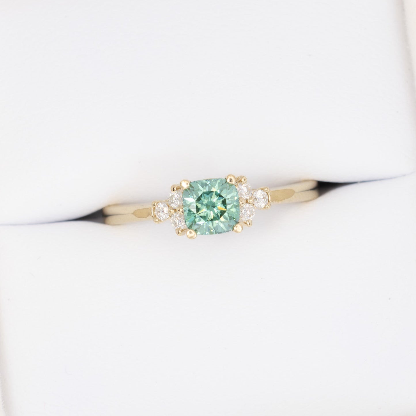 cynthia engagement ring with green moissanite cushion in yellow gold