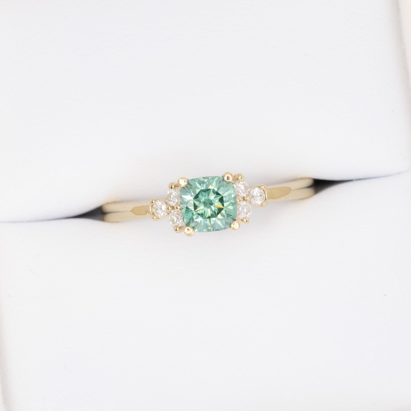 cynthia engagement ring with green moissanite cushion in yellow gold