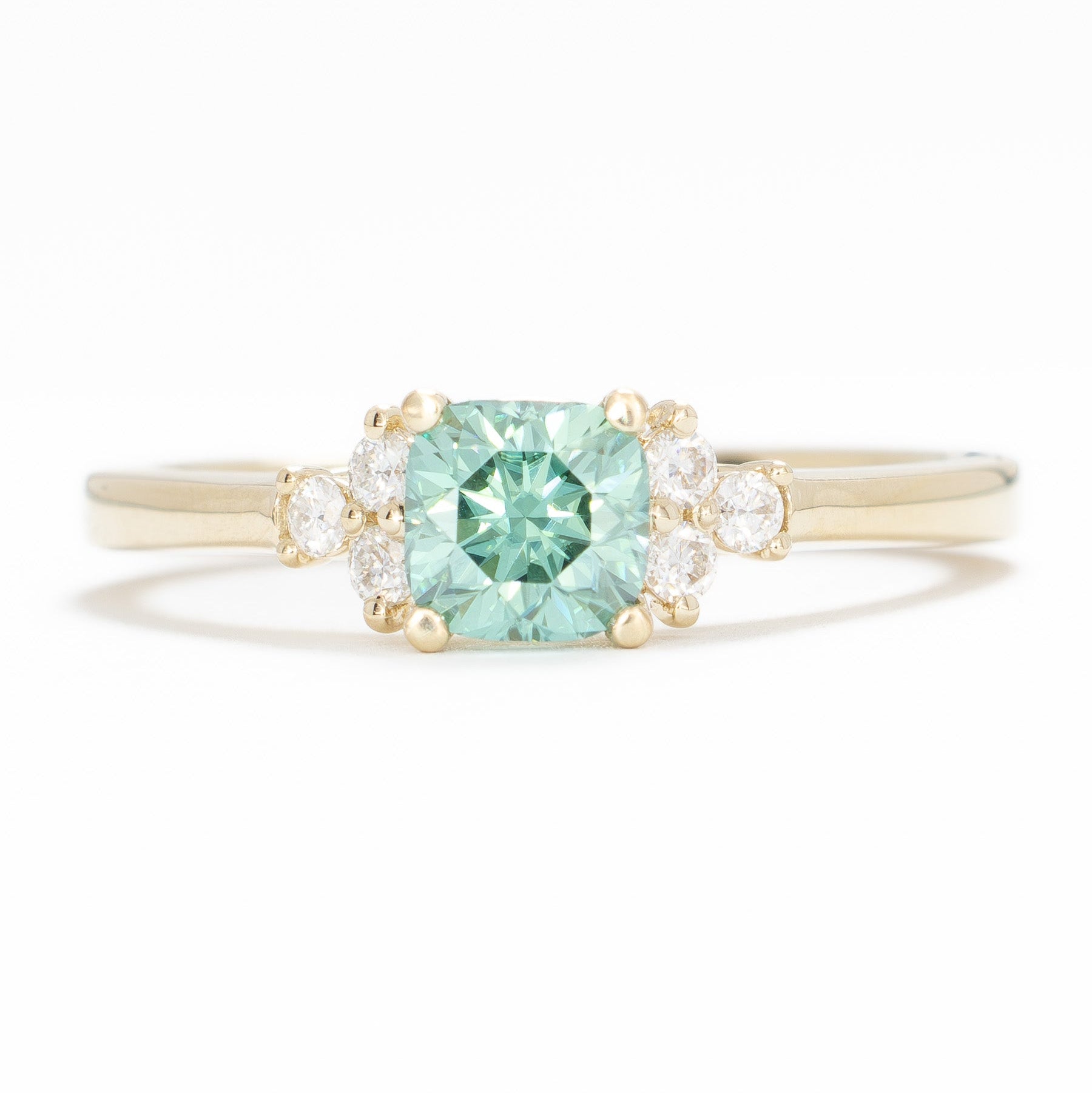 cynthia engagement ring with green moissanite cushion in yellow gold