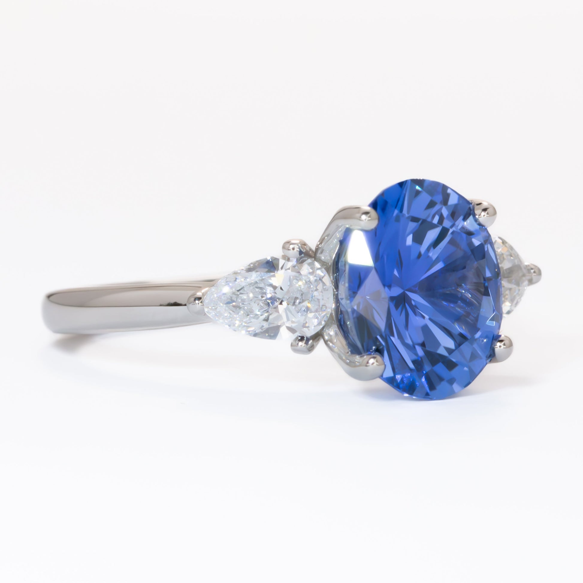 Tawnee three stone engagement ring with oval lab sapphire