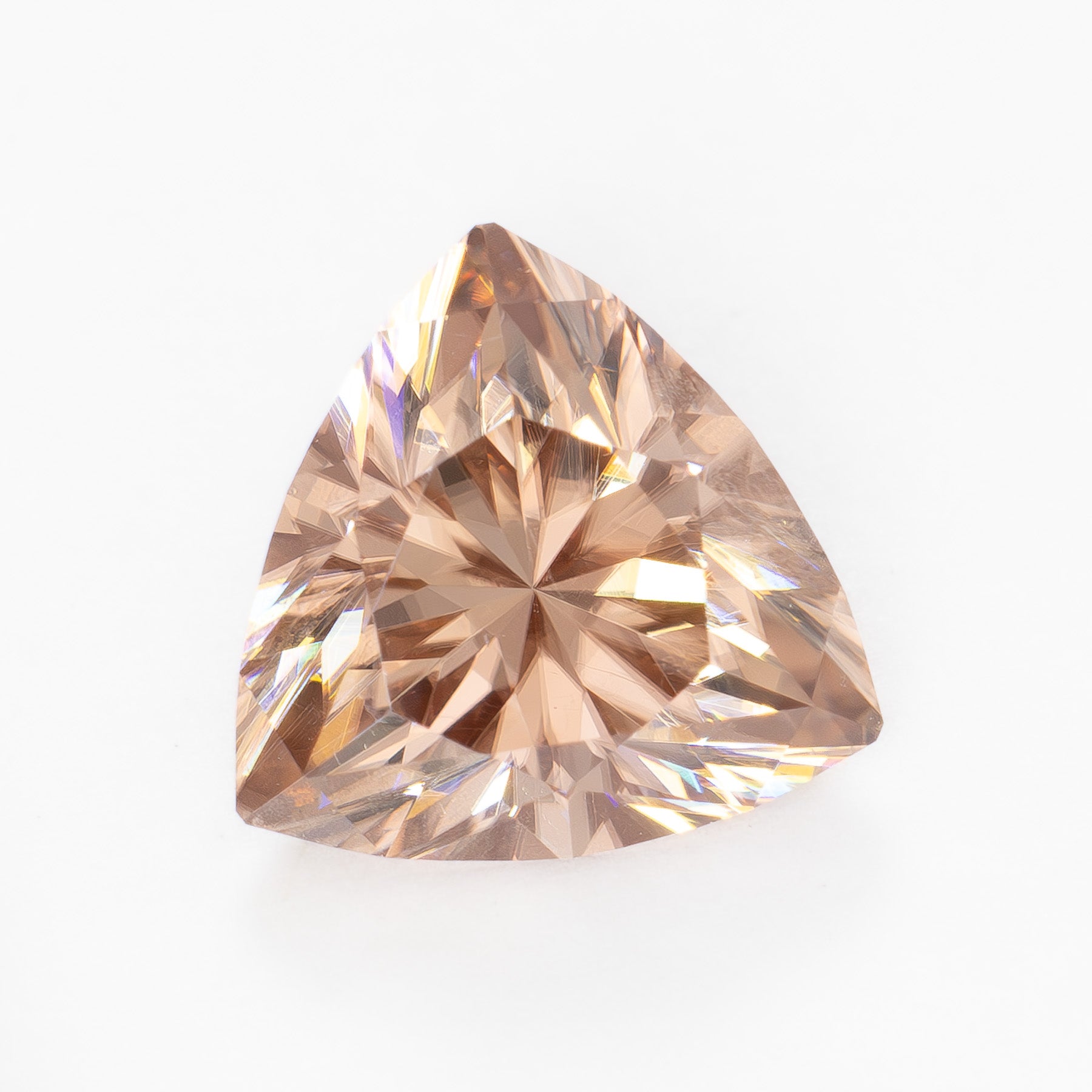 ZR0134 3.09ct champagne peach trillion cut zircon