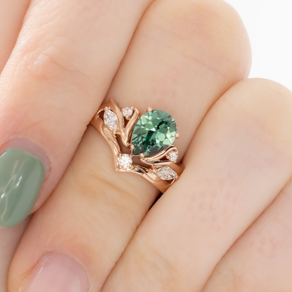 adira nature inspired ring in rose gold with green lab sapphire pear