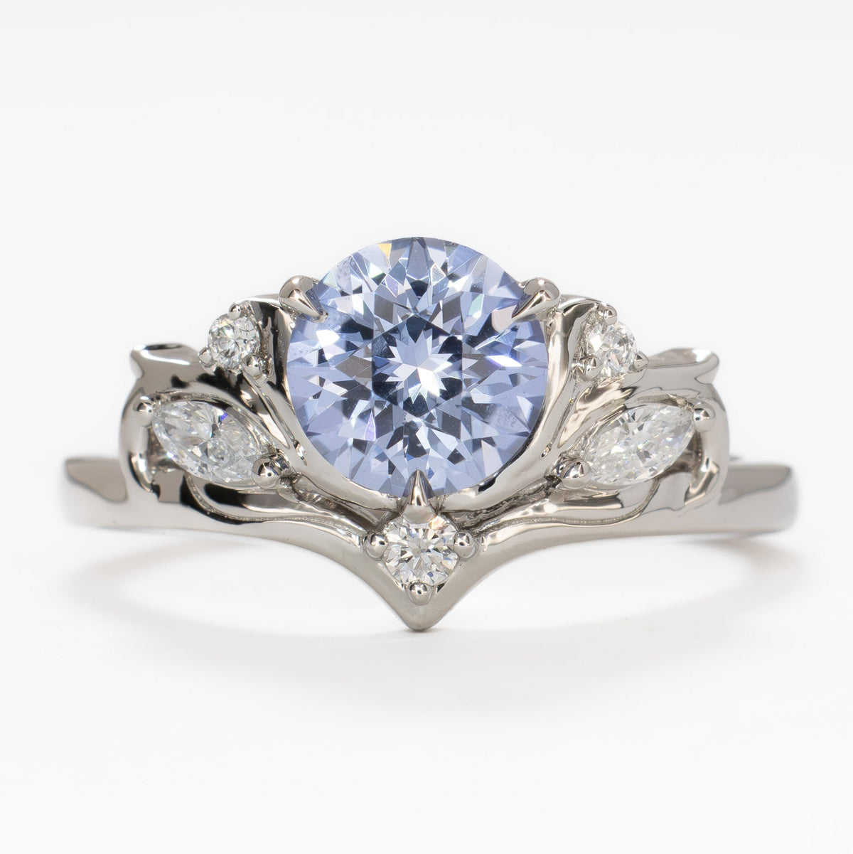 adira nature inspired ring in white gold with round light blue lab sapphire